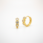 Gold hoop earrings with heart-shaped CZ