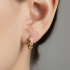 gold earring with heart-shaped CZ