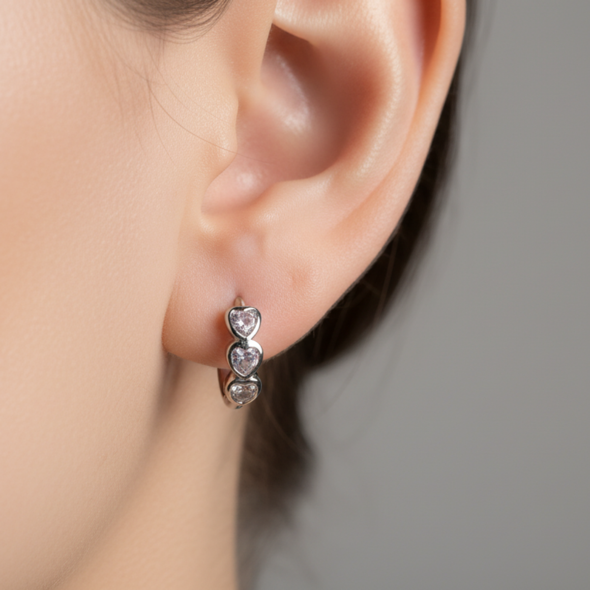 silver heart-shaped earring