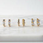 Trinity — Set of Three Huggie Earrings