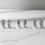 Trinity — Set of Three Huggie Earrings