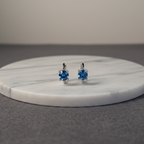 Lorelei — Sterling Silver Blue Round Cut Huggie Earrings
