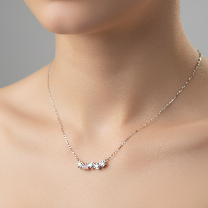 Silver necklace with heart-shaped pendants 